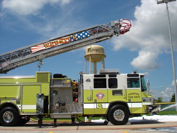 Fire truck in front of water tower