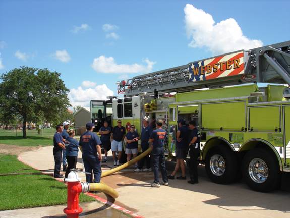 Fire fighters by fire truck