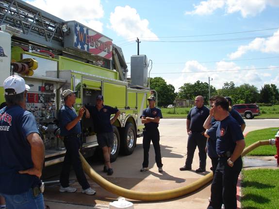 Fire fighters next to fire truck