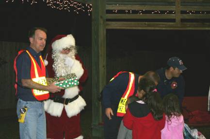 Santa Claus with officers and children